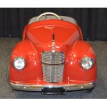 An Austin J40 Pedal Car with red paintwork which has been repainted at some time and appears