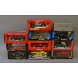 Eleven boxed 1:18 scale diecast model cars by various manufacturers including examples by Guiloy,