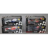 Four boxed Minichamps 1:18 scale Formula 1 racing cars including a ,