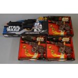 Three boxed Star Wars Episode 1 Electronic Tatooine Blaster Pistols in a Trade box and a Star