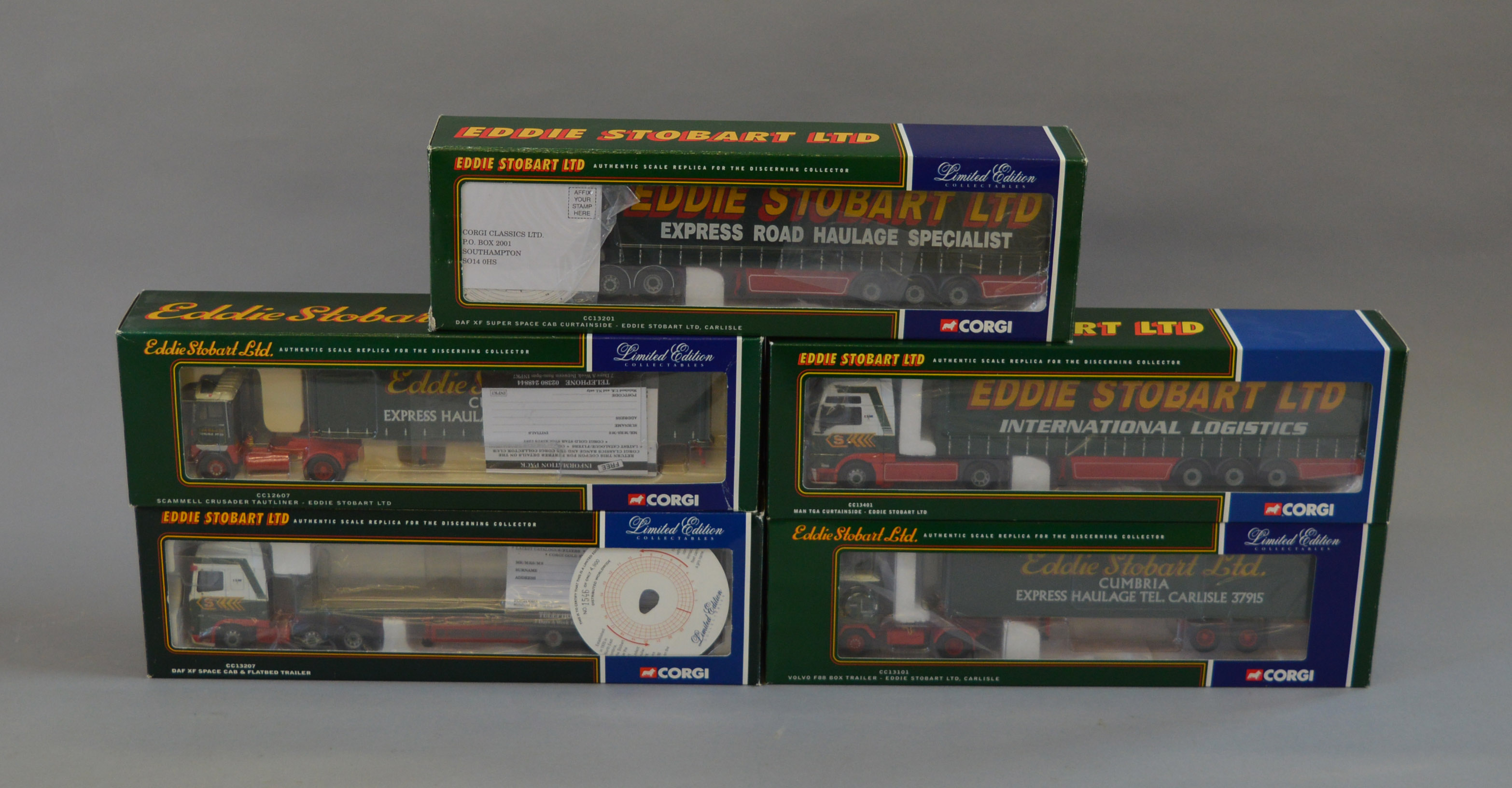 Five boxed Corgi Eddie Stobart 1:50 scale trucks, CC13207 DAF, CC13101 Volvo, CC13401 MAN,