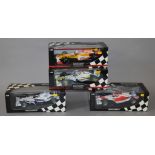 Four boxed Minichamps 1:18 scale Formula 1 racing cars including a limited edition model,