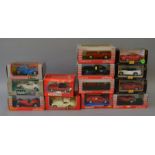 Thirteen boxed diecast model cars, mainly in 1:24 scale,