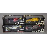 Four boxed Minichamps 1:18 scale Formula 1 racing cars including a limited edition model,