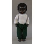 An unboxed Pedigree 'Dixie' doll, approximately 52cm tall and made of hard black plastic,