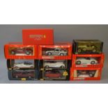 Ten boxed diecast model cars, mainly in 1:18 scale,