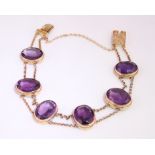 A Victorian Amethyst set bracelet, consisting of six oval stones in a rope twist setting,