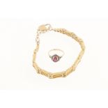 A ladies gilt metal gate bracelet with padlock & a white & yellow metal red stone & marcasite ring,