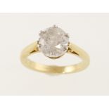 An 18ct H/M diamond solitaire ring, the round brilliant cut diamond approx 2.