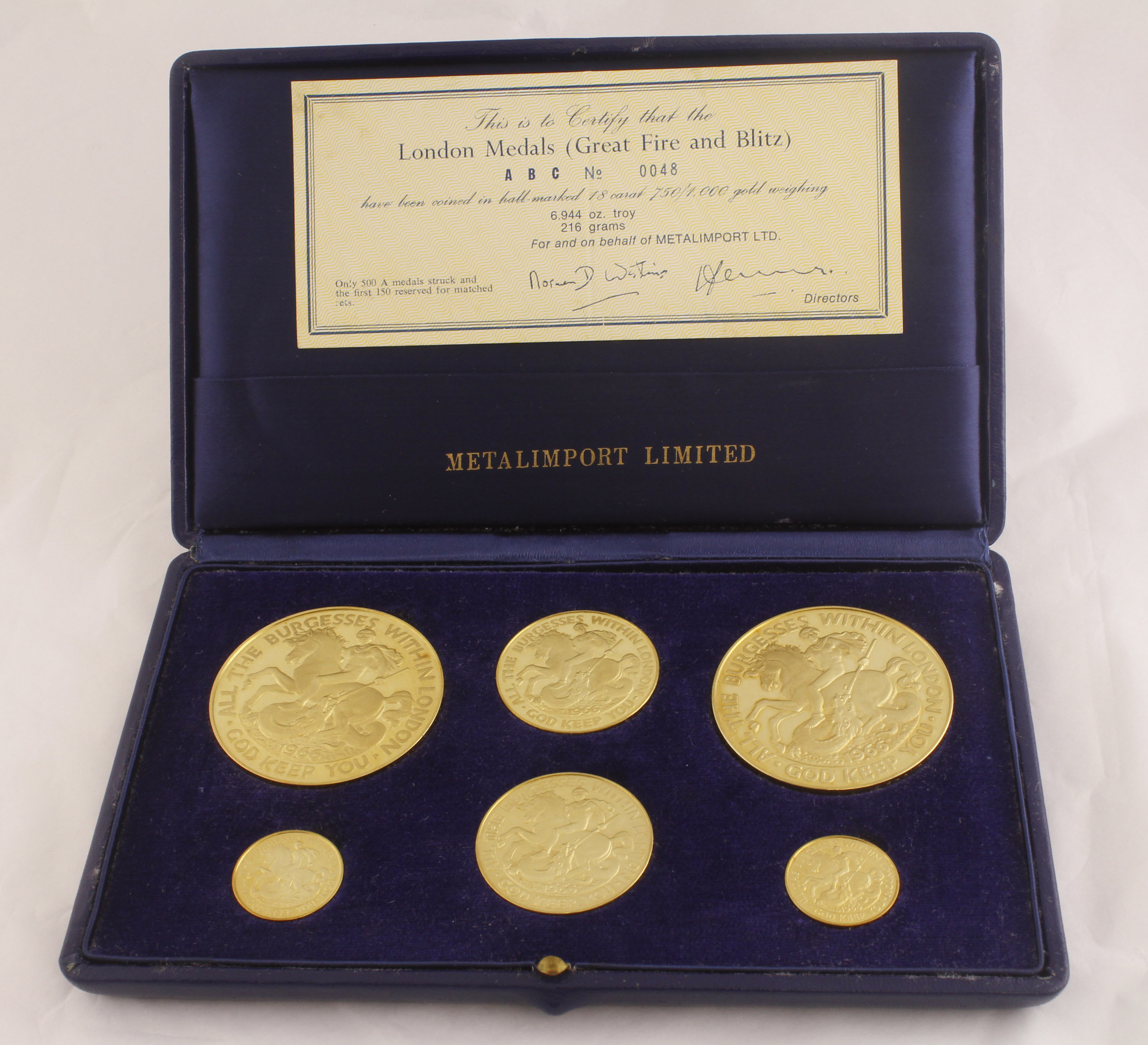 A cased set of six 18ct H/M medallions by Metalimport Ltd commemorating "London Medals (Great Fire