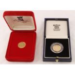 A Royal Mint cased half-sovereign dated 1990 with certificate together with an Isle Of Man
