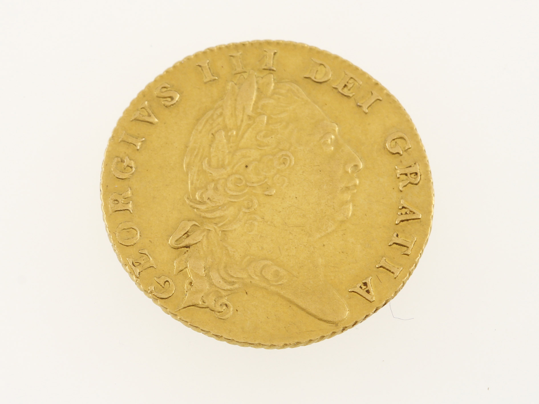 A George III half-guinea dated 1801,