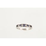 An 18ct H/M white gold sapphire and diamond channel set eternity ring,