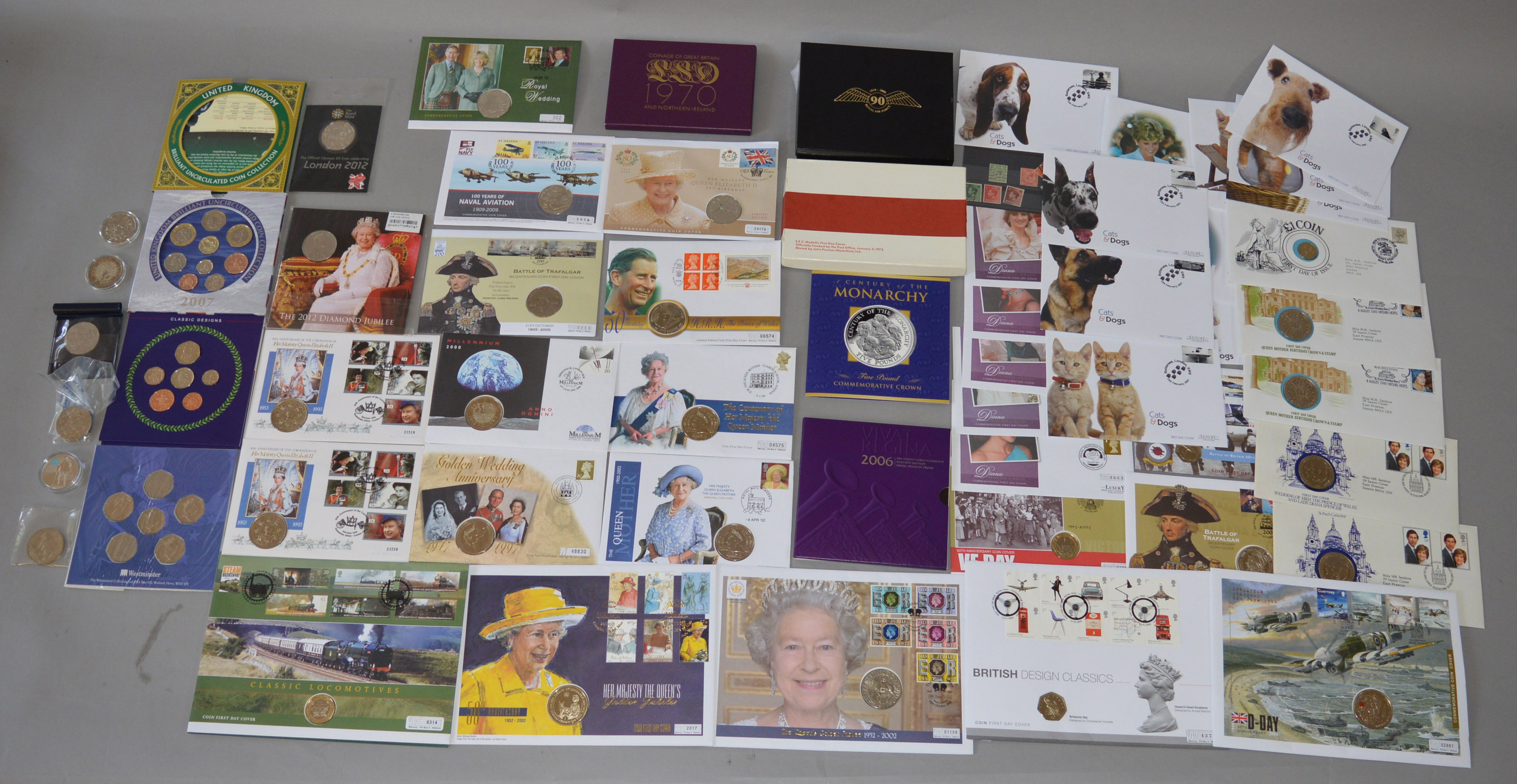 A quantity of coins to include Royal Mint proof sets, £5 coins (some in covers),