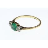 An Emerald and Diamond three-stone ring stamped 18ct, approx total Diamond weight 0.