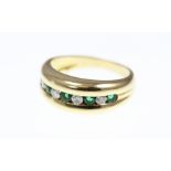 An 18ct H/M Emerald and Diamond 9-stone half eternity ring, size L, approx 5.