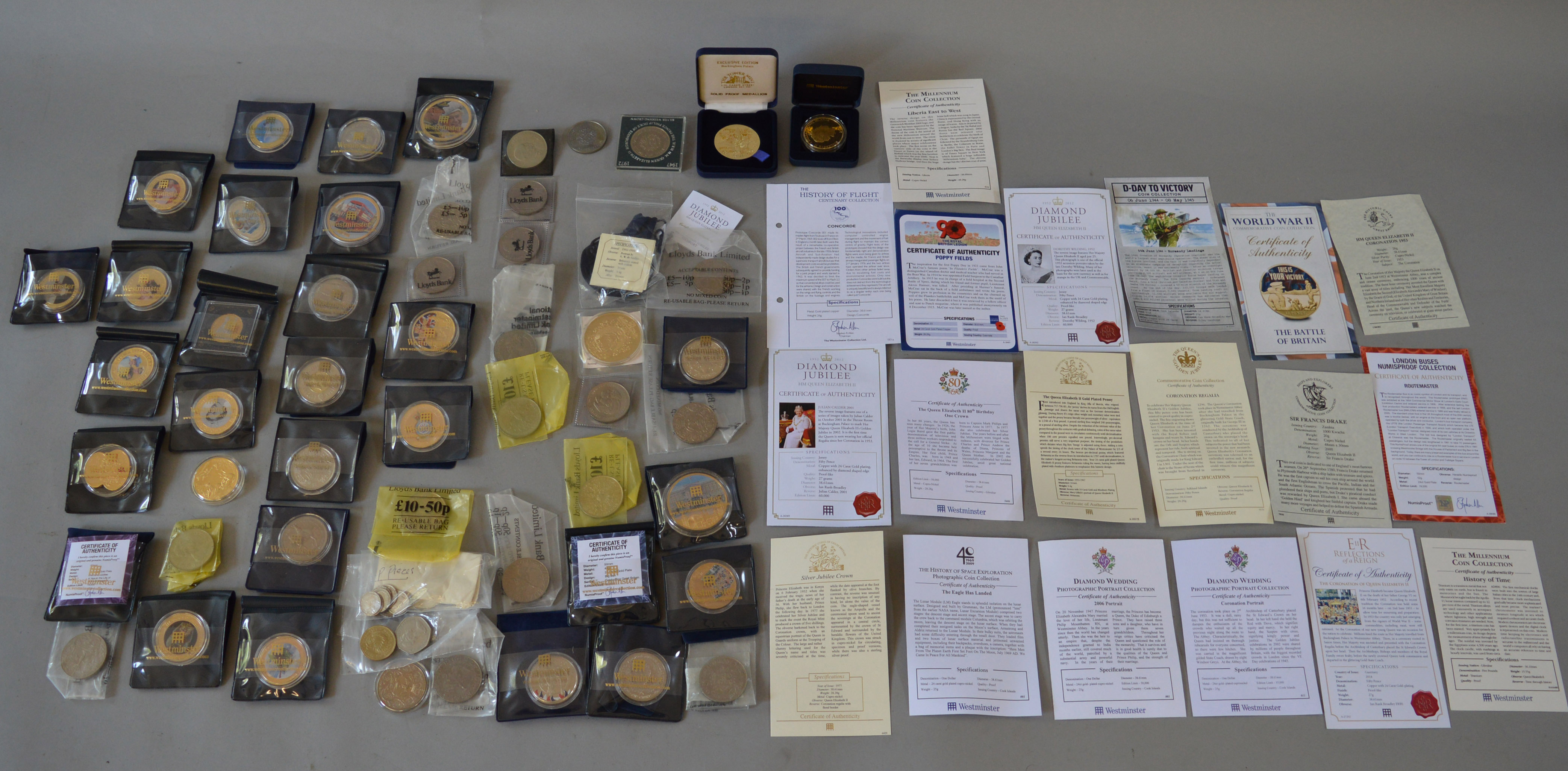 A boxed quantity of commemorative coins/medallions (most with certificates),