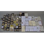 A boxed quantity of commemorative coins/medallions (most with certificates),