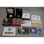 Four Royal Mint £5 silver proof commemorative coins, a silver proof 50p Christopher Ironside coin,