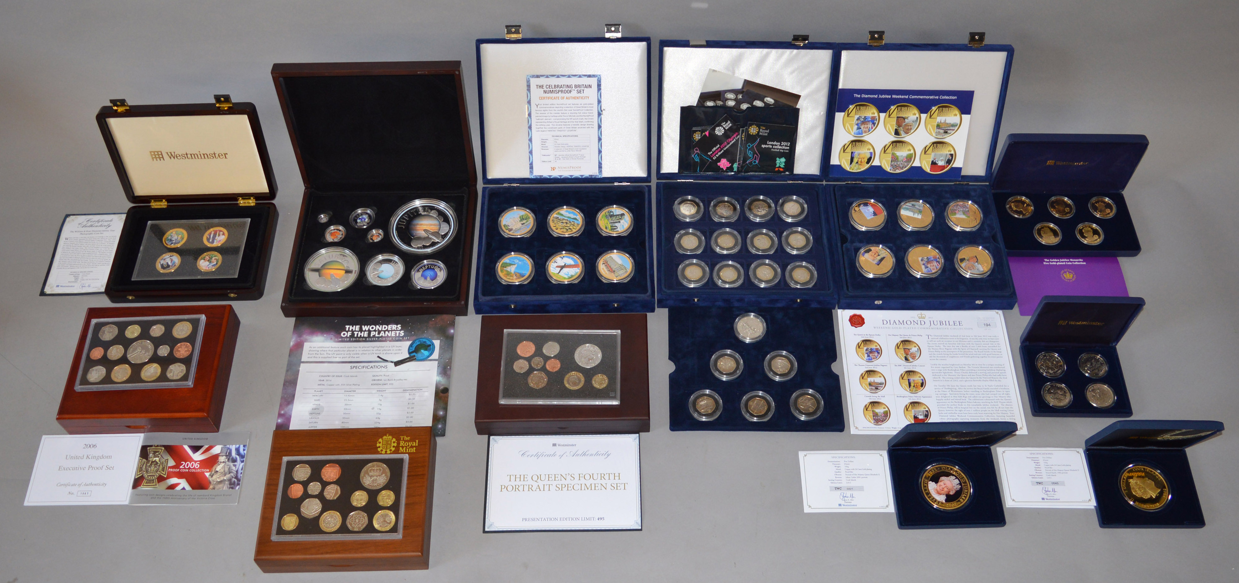 A large boxed quantity of commemorative coins/medallions,