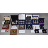 A large boxed quantity of commemorative coins/medallions,