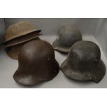 Collection of German and British WW1 and WW2 helmets including two possibly reproduction/ or prop