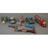 A small quantity of tinplate and plastic space toys, one of which is boxed.