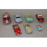 Seven unboxed tinplate cars, mostly of Chinese manufacture,