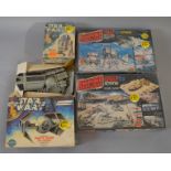Four Star Wars boxed model kits.