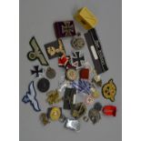 A collection of mostly Third Reich and similar related memorabilia including badges, medals, etc.