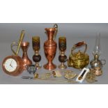 A mixed lot of metalware, mostly copper and brass with various vintage oil lamps etc.