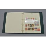 A collection of USA stamps contained in commemorative album. Used and Unused. 1919-recent.