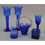 6 items of cobalt blue glassware including candlesticks and a bon bon dish