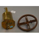 A brass clockwork meatjack with an iron wheel.
