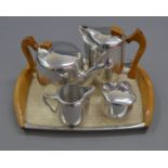 A 5-piece Piquot Ware Tea set including teapot,