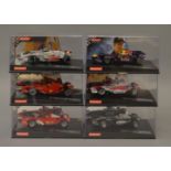 6 x Carrera cars. Red Bull RB5 Sebastian Vettel No 15. Panasonic Toyota Racing TF105 No17.