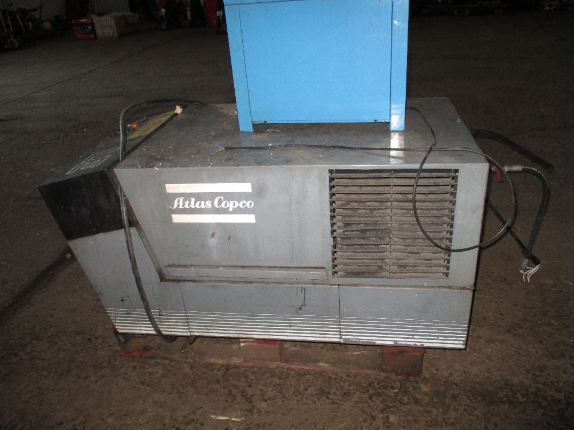 Atlas Copco packaged air compressor with receiver sourced from garage company liquidation