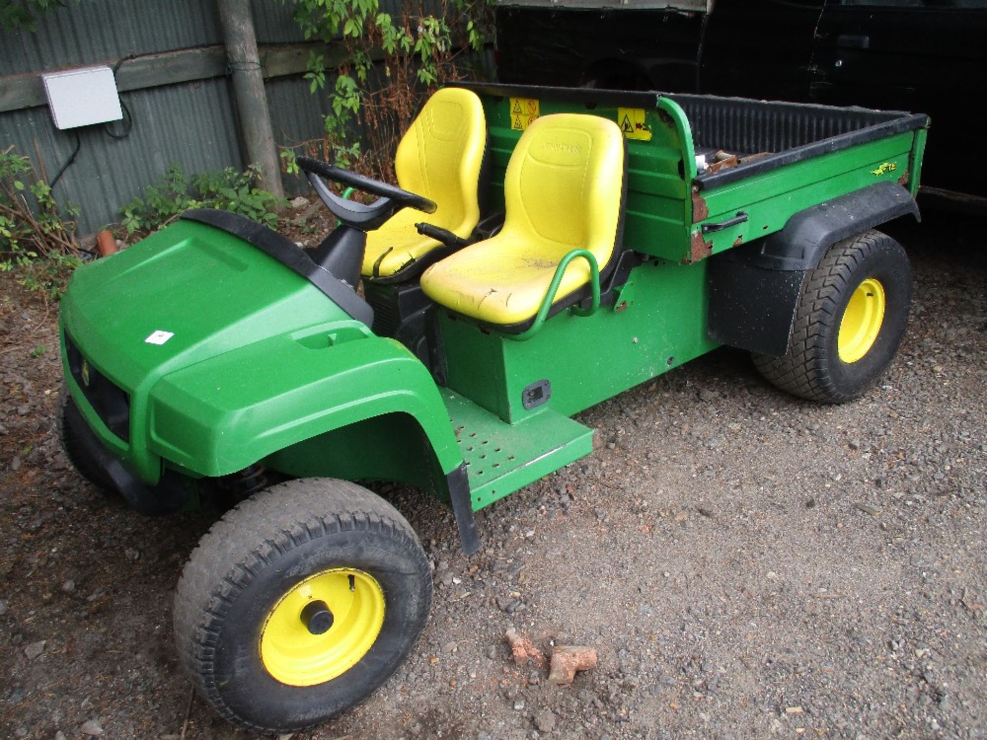 John Deere electric powered utility vehicle with electric tip.