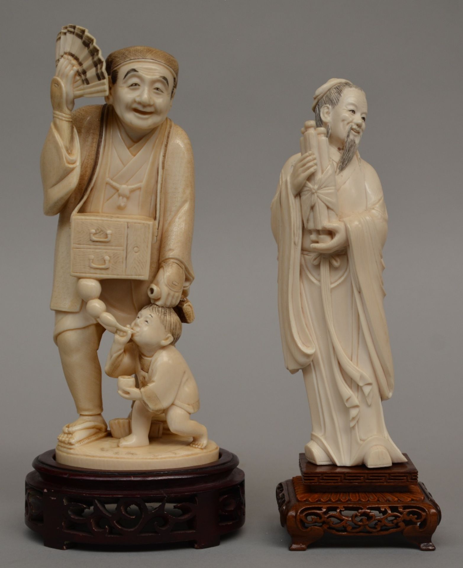 A Japanese ivory okimono of a soap vendor, Meiji period, H 24 cm (without base) - 28 (with base),