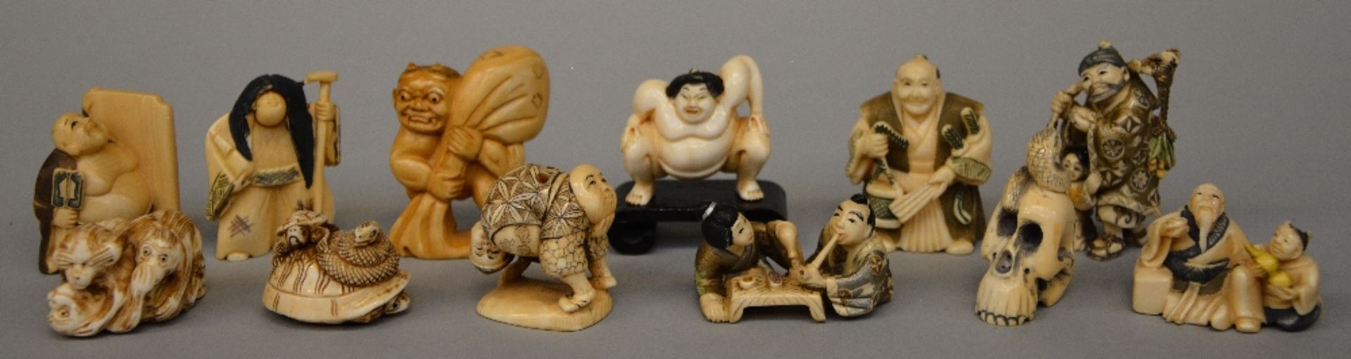 Various netsuke and little okimono, some scrimshaw decorated, Japan, late Meiji period or Interwar