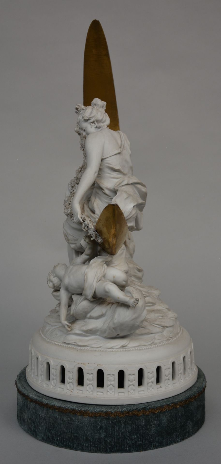 An allegorical statue in biscuit, partially gilt, late 19thC, H 49 cm (damage on the flower - Image 2 of 5