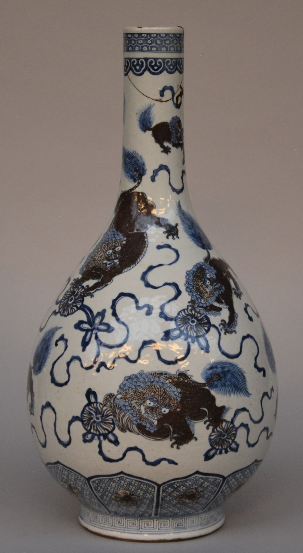 A Chinese polychrome decorated vase depicting Qilins, marked, 19thC, H 51,5 cm (restoration on the