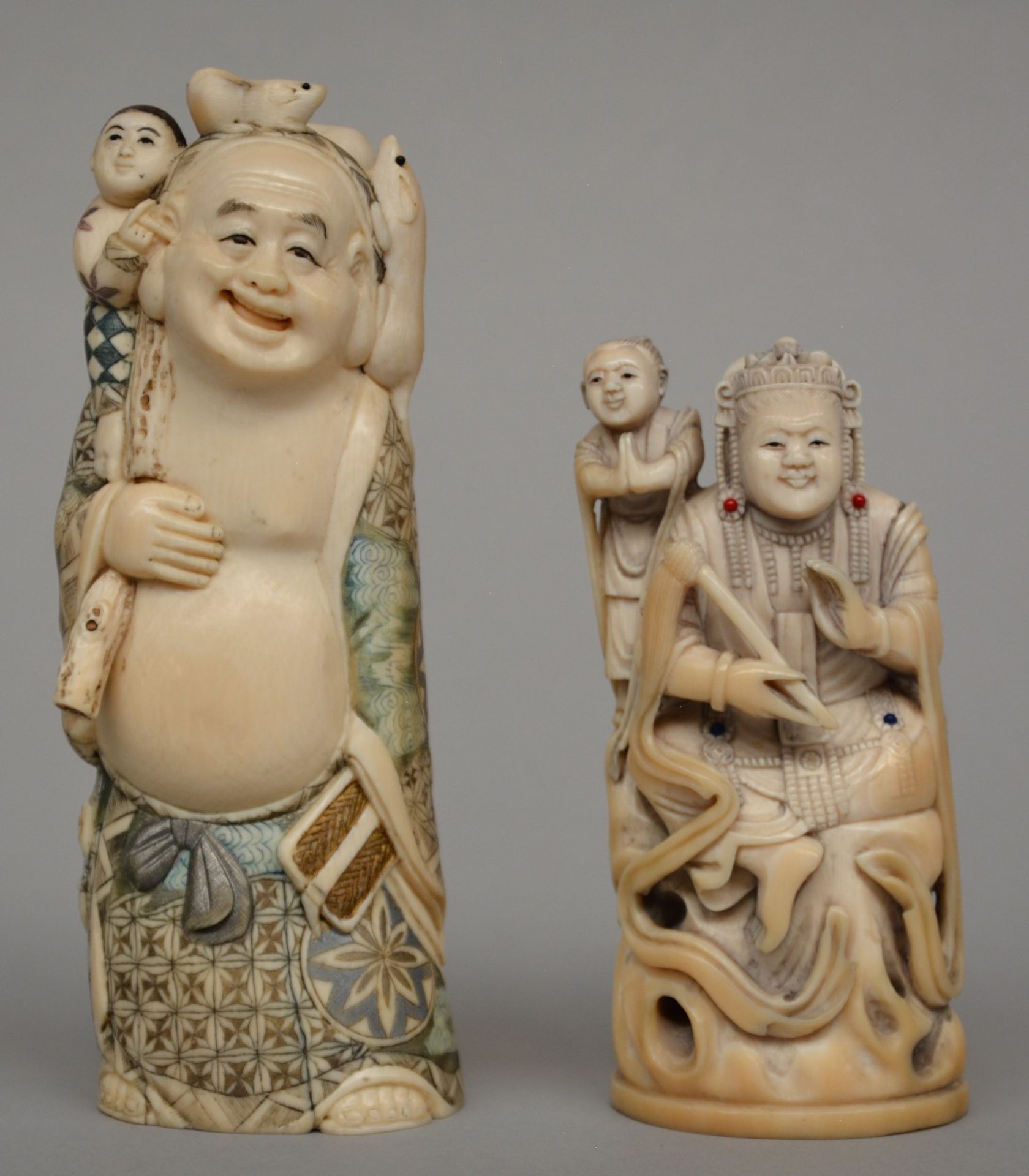 A Japanese ivory sculpture of a mythological figure, scrimshaw decorated, late Meiji period, H 16,