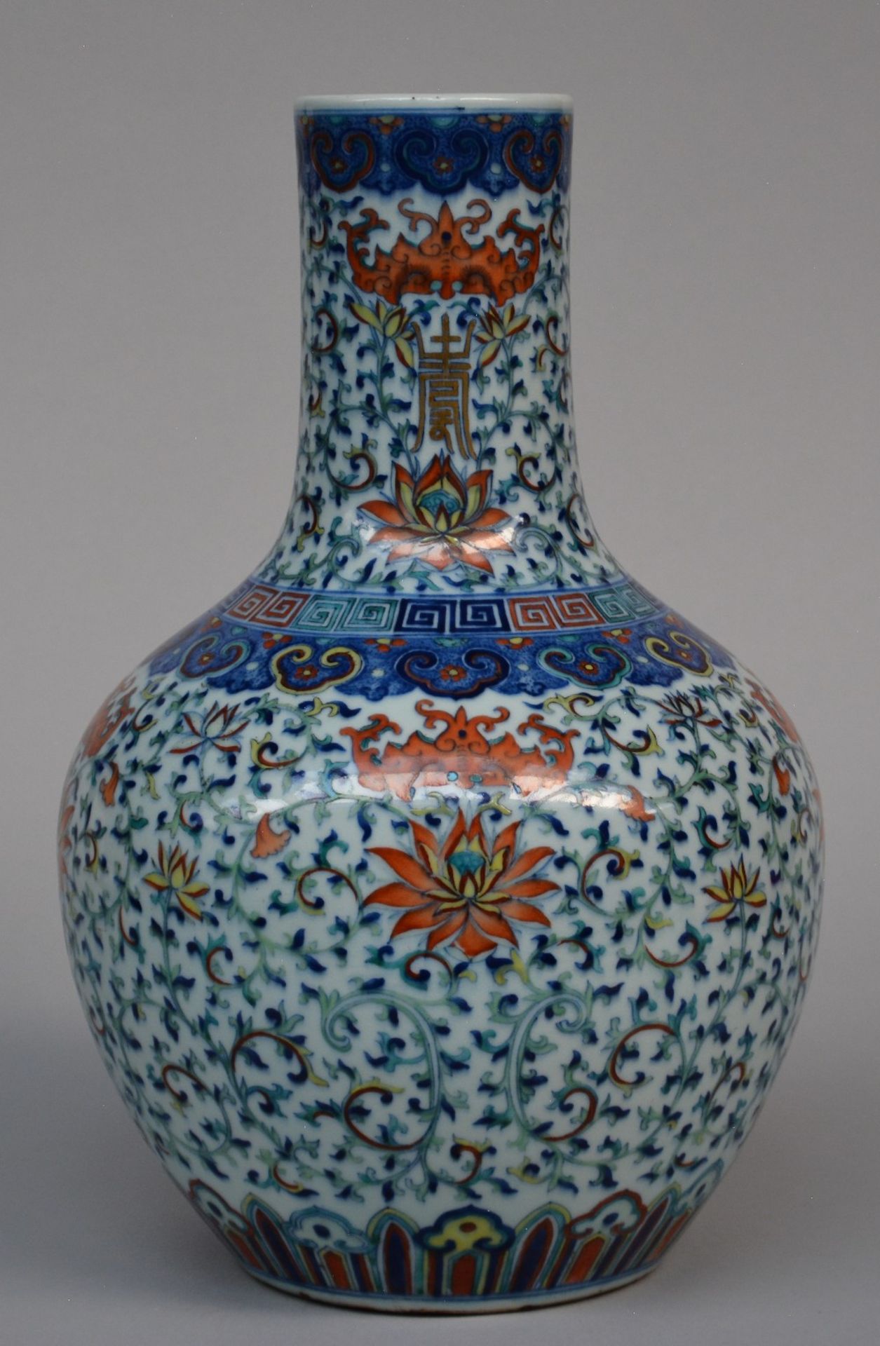 A fine Chinese 'Tianqiuping' vase with doucai enamels: four iron-red lotus flowers, surrounded by