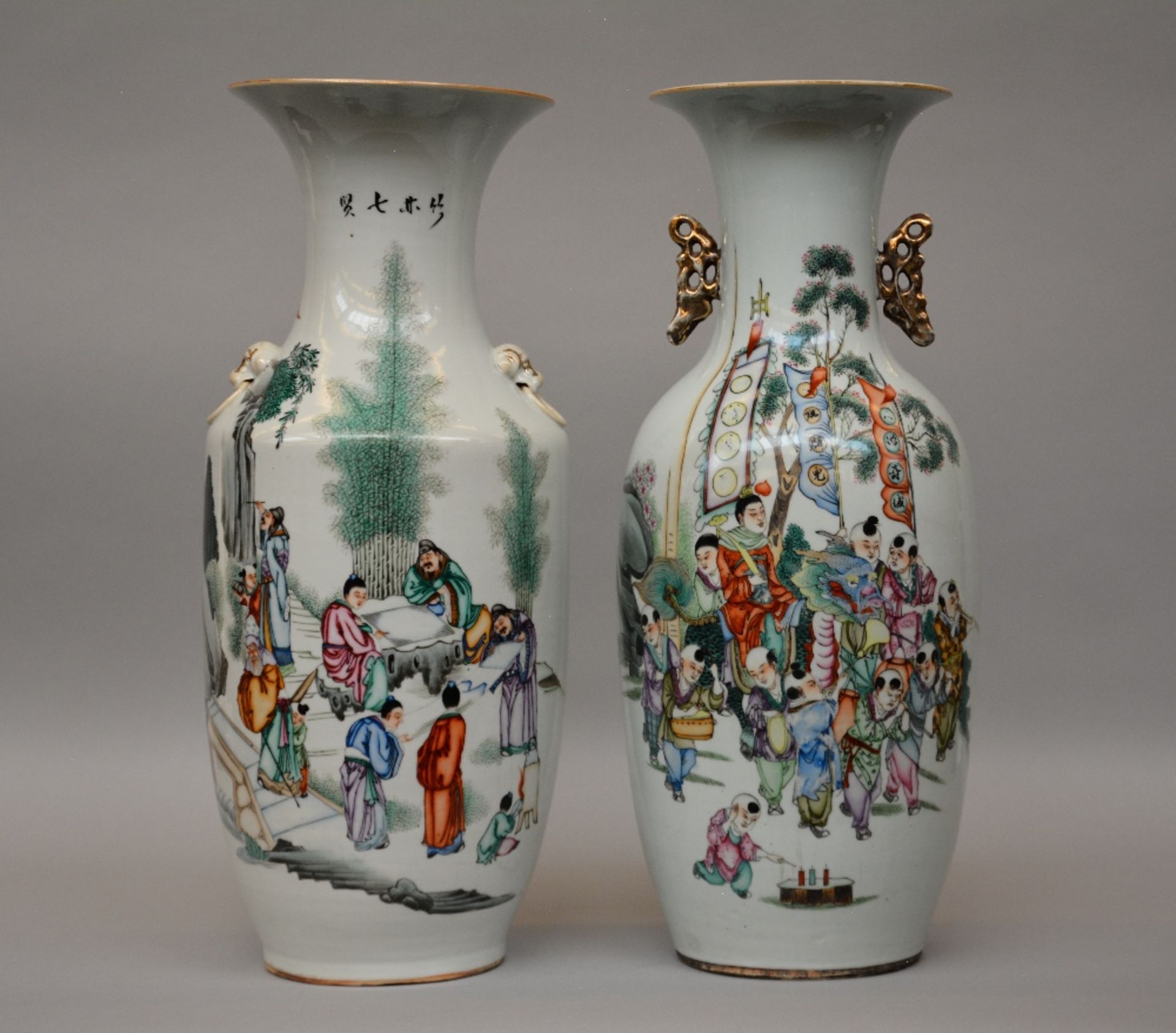 Two Chinese polychrome decorated vases, painted with animated scenes, H 57 cm