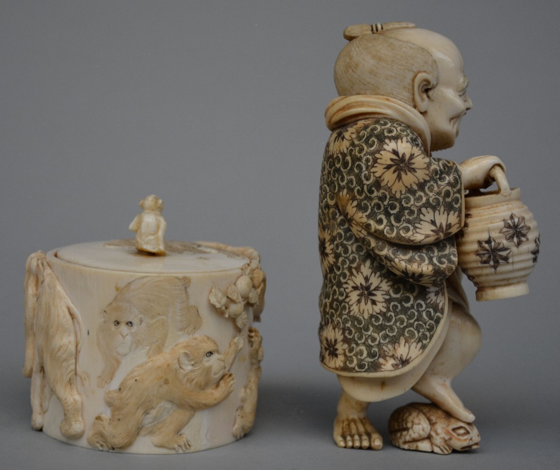 A Japanese ivory okimono of a man holding a lantern and stepping on a toad, scrimshaw decorated, - Image 4 of 7