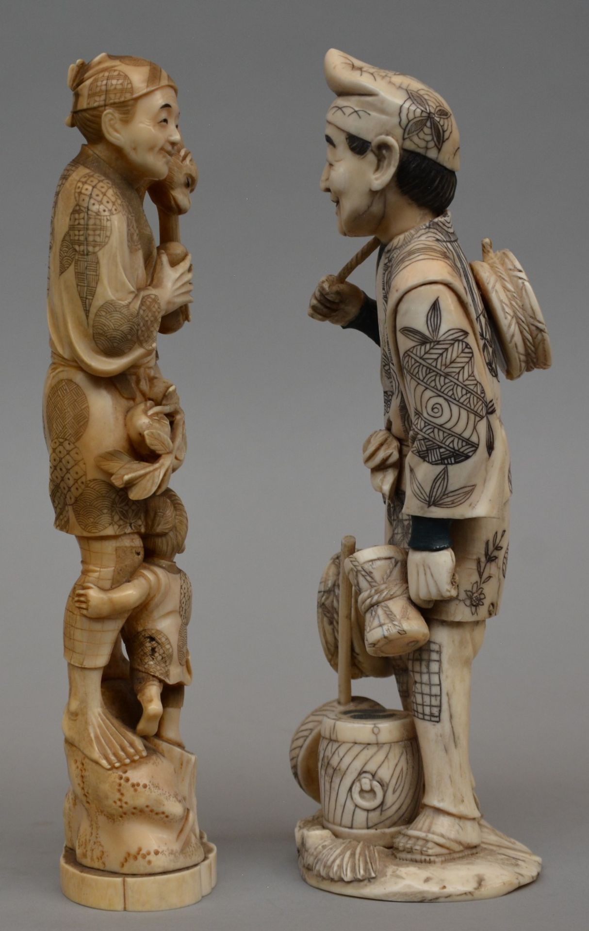 Two Japanese ivory okimono figure of a peasant with a child and monkey; added a peddler, both - Image 2 of 8