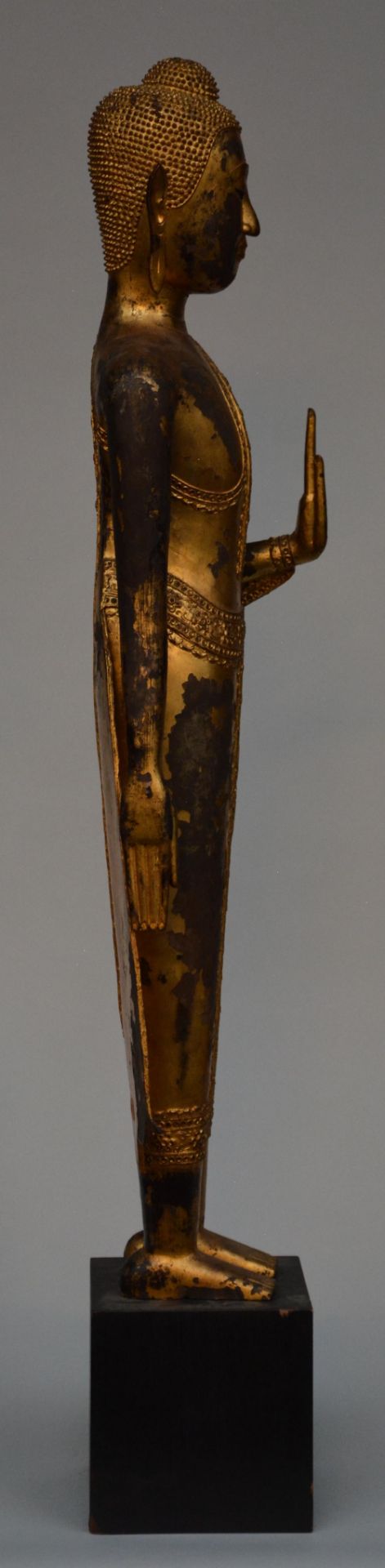 An Oriental gilt standing Buddha on a wooden base, H 126 cm - Image 4 of 4