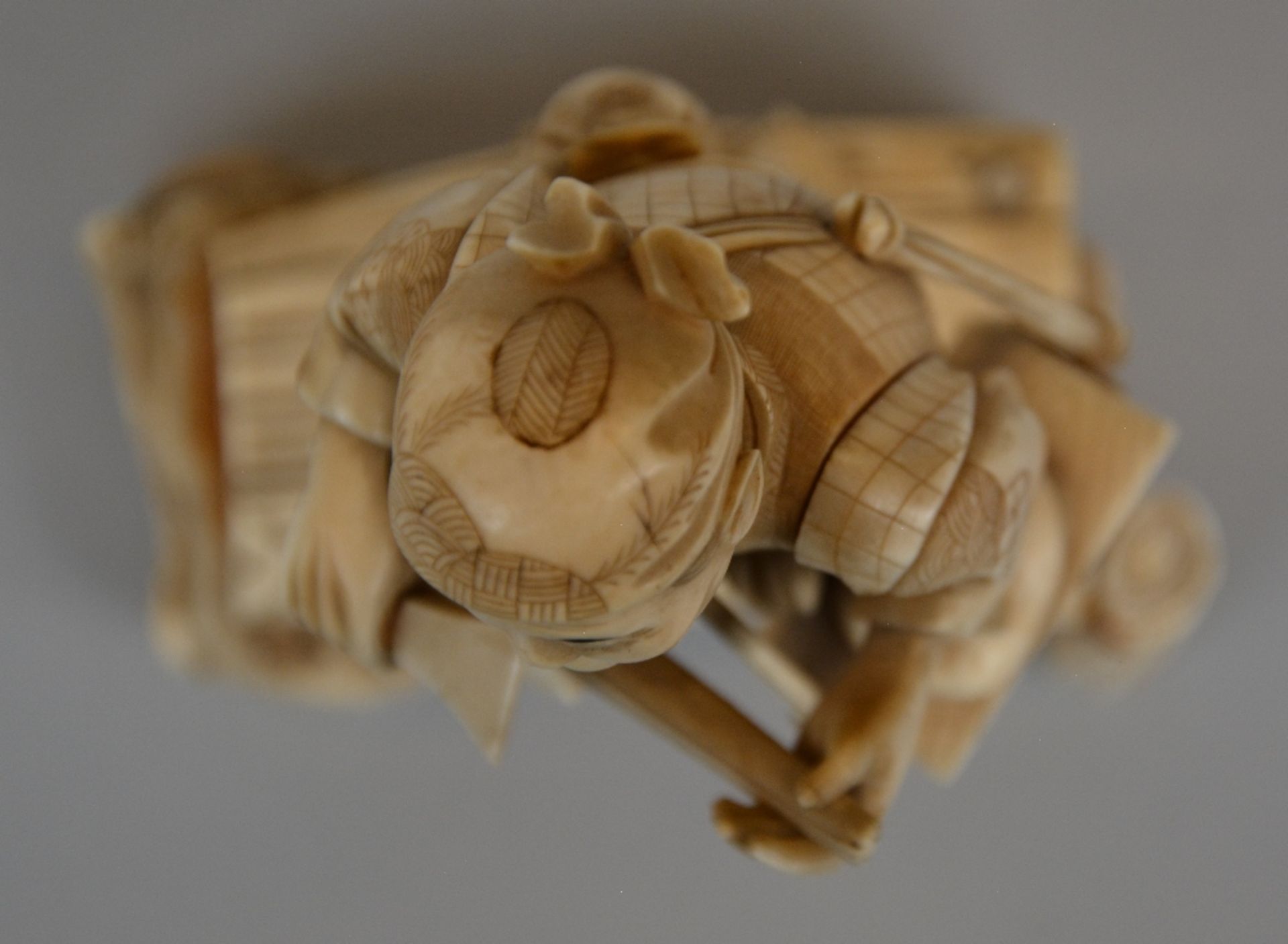 A Japanese ivory okimono figure of a peddler, scrimshaw decorated, Meiji period, H 20 cm; added a - Image 5 of 8