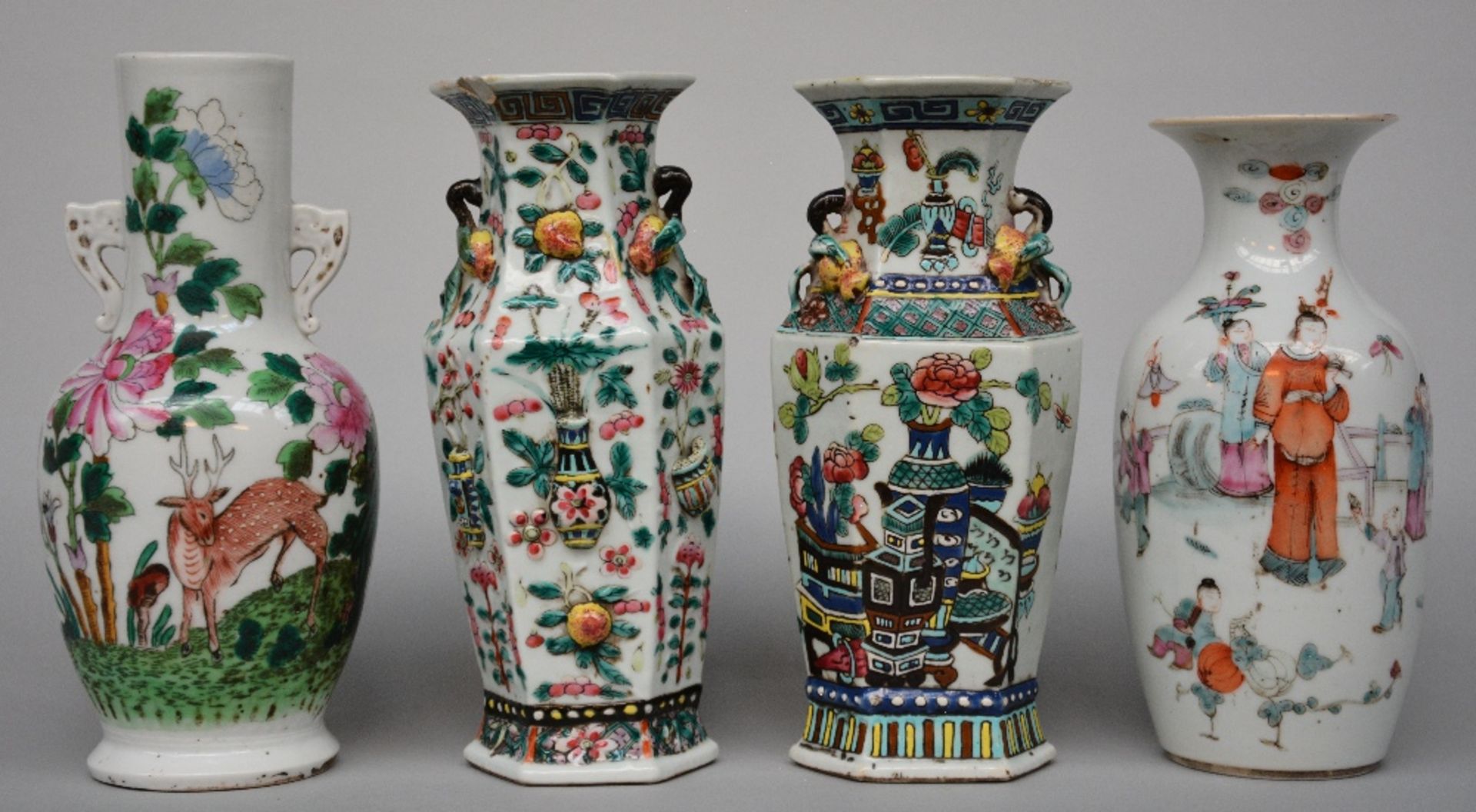 Four Chinese polychrome decorated vases depicting figures, birds, a deer and other symbols, H 22 -24